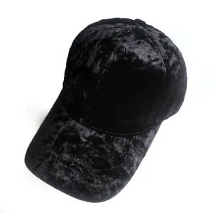 Close-up of black velvet baseball cap showing vintage texture and curved brim detail