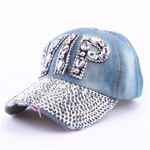 Detail view of denim VIP baseball cap with purple rhinestones and silver studded brim