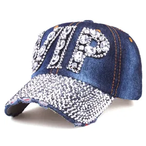 Macro view of blue denim VIP baseball cap showing intricate hand-set rhinestones
