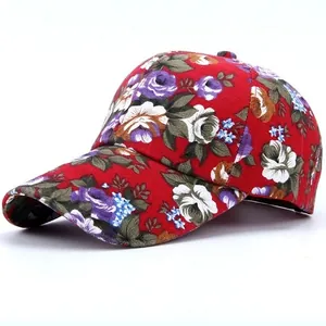 Detail view of red baseball cap with vibrant floral pattern and durable canvas texture
