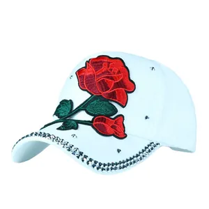 White baseball cap with red rose embroidery and sparkling rhinestone rim for women