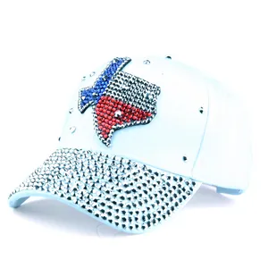 Detail of light blue baseball cap featuring sparkling Texas map rhinestone embellishment