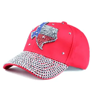 Detail of red rhinestone baseball cap with Texas map design and silver studs on brim