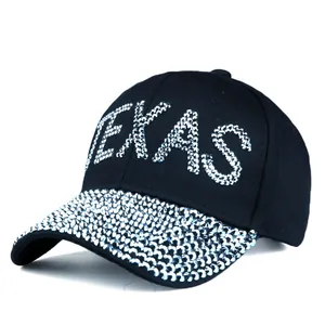 Black baseball cap with sparkly silver rhinestones and TEXAS lettering on white background