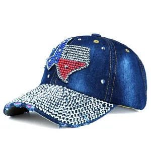 Detail of blue denim baseball cap with Texas rhinestone map and silver studded brim