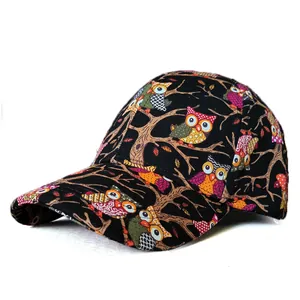 Detailed side view of black cotton baseball cap with colorful cartoon owl pattern prints