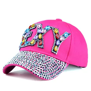 Close-up of bright rose baseball cap with SEXY crystal letters and silver rhinestones
