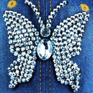 Blue denim baseball cap with a sparkling rhinestone butterfly and floral embroidery
