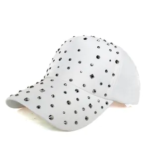 Close-up of white baseball cap with sparkling dark rhinestones on high-quality fabric