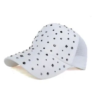 Detail of white mesh baseball cap featuring decorative rhinestones and breathable back
