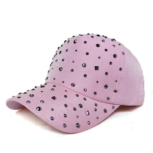 Close-up of pink baseball cap featuring sparkling dark rhinestones on fabric