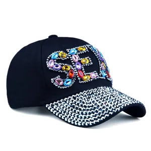 Detailed view of colorful SEXY rhinestones and silver crystals on a black baseball cap