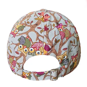 Rear view of light blue baseball cap with colorful owl print and metal buckle adjustment