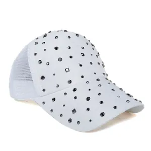 Close-up of white baseball cap featuring sparkling rhinestones and breathable mesh detail