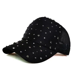 Macro detail of black trucker hat featuring metal rivets and breathable mesh back