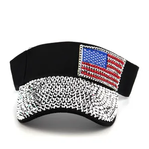 Close-up of black sun visor hat with silver rhinestones and American flag diamond patch
