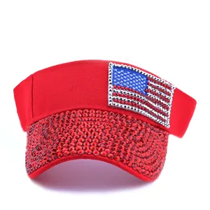 Detail of red sun visor with handmade rhinestones and American flag pattern