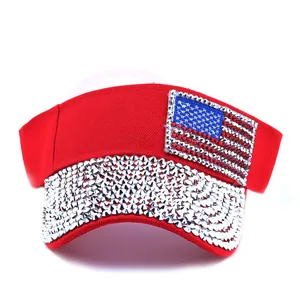 Red sun visor hat with American flag rhinestones and glittery studded brim detail