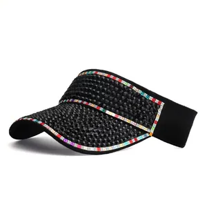 Detail of black sun visor with sparkling rhinestones and colorful edge trim decoration