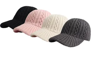 Close-up of cable knit texture on winter baseball caps in four assorted colors