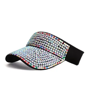 Close-up of sparkling colorful rhinestones on a black sun visor hat with elastic band