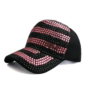 Detailed view of bicolor pink and black rhinestones on a baseball cap brim