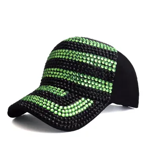 Detail of baseball cap with black and green rhinestones in a striped pattern