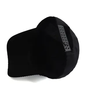 Detailed view of the black baseball cap showing interior lining and snapback closure
