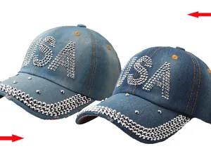 Detailed view of denim baseball cap with silver USA rhinestones and decorative stitching