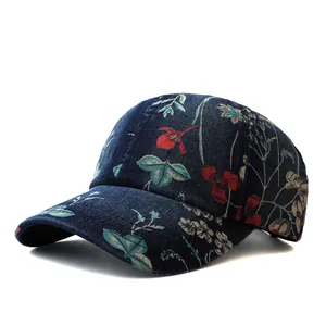 Detail of floral embroidery on dark blue denim baseball cap with curved brim