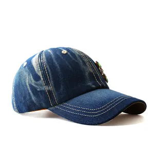 Washed denim baseball cap with rhinestone flower accents and yellow contrast stitching