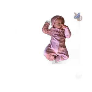 Realistic 18-inch sleeping reborn baby doll in pink bunny outfit with pacifier