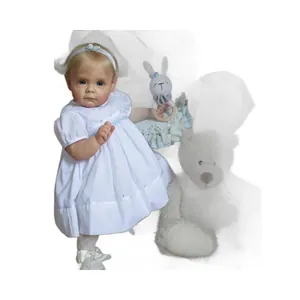 Realistische Toddler Maggi Reborn-Puppe mit blondem Haar, blauem Auge und weißem Stickkleid