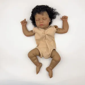 Realistic 18-inch newborn baby doll with dark skin and curly hair in beige romper