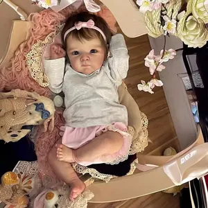 Realistic 18-inch Bettie reborn baby doll in grey top and pink lace pumpkin pants