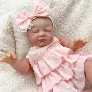 Realistic 19-inch reborn baby doll sleeping in pink polka dot dress and bow headband