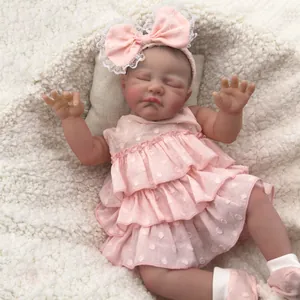 19 inch hand-painted reborn baby doll sleeping in pink dress on soft white fleece