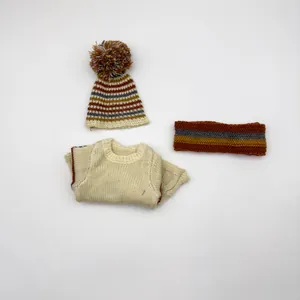 Three-piece knit doll outfit with cream sweater, striped pom-pom hat and headband