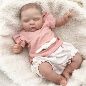 Detailed view of the lifelike 3D painted skin and sleeping face of the 50cm reborn doll
