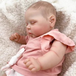 Sleeping 50cm reborn baby doll with 3D hand-painted skin resting on a soft rug