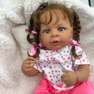 Lifelike 19-inch reborn baby doll with blue eyes and braided brown hair on white plush