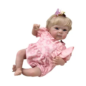 Realistic 18-inch reborn baby doll Bettie in pink daisy outfit with floral headband