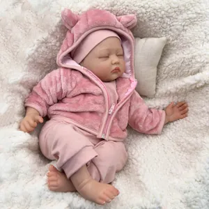 55cm lifelike reborn baby doll in pink plush hoodie sleeping on soft white faux fur