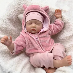 55cm lifelike reborn baby doll in pink plush hooded outfit sleeping on soft white rug