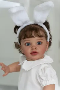 Detailed close-up of 26-inch lifelike toddler PIPPA doll with lace top and bunny ears