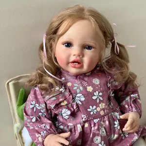 60cm realistic reborn baby doll with brown curly hair and floral dress in a soft pose