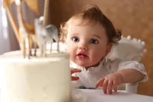 Detail of 60cm reborn doll with realistic skin texture, blue eyes, and white lace outfit