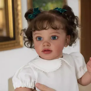 26 inch lifelike reborn toddler Pippa with curly brown hair and white lace top