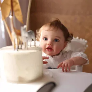 Realistic 60cm reborn baby doll Lottie with visible veins and white lace dress