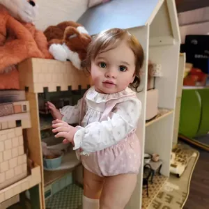 Lifelike 26 inch Reborn Doll Pippa in floral outfit with realistic brown curly hair